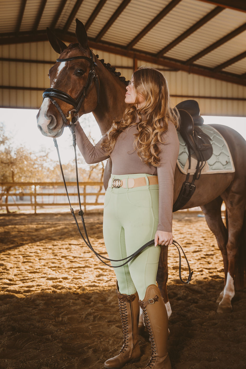 Canter Culture's green riding tight matches great with PS of Sweden Khaki saddle pad.